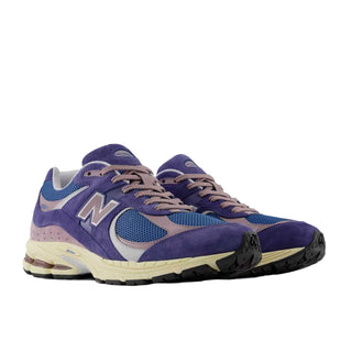 Tenis Unisex New Balance 2002R Morado vista par frontal