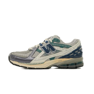 Tenis Unisex New Balance 1906 Gris Azul Marino vista portada